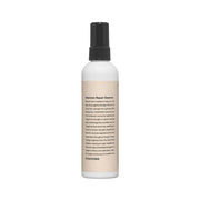 ProtoClinical k-beauty taupe vertical beauty product silhouette with pale peach side accents on a light background.
