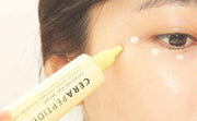 ProtoClinical k-beauty [so natural] Cera Peptide Ceramide Eye Serum 30ml single pale yellow bottle-style package centered on a warm yellow background