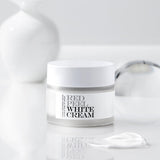 ProtoClinical k-beauty [so natural] Red Peel White Cream 50g single upright gray cream package centered on a cool white and pale blue striped background