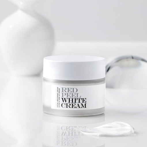 ProtoClinical k-beauty [so natural] Red Peel White Cream 50g single upright gray cream package centered on a cool white and pale blue striped background