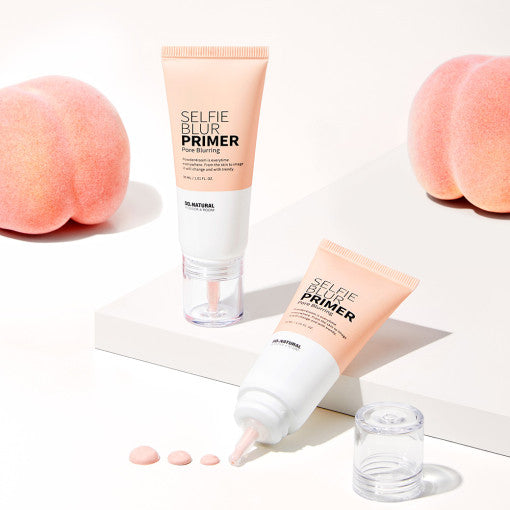 ProtoClinical k-beauty [so natural] Selfie Blur Primer 30ml shown as a warm beige primer package centered on a light background with dark brown upper corners and pale aqua lower accents