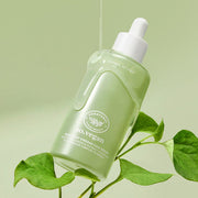 ProtoClinical k-beauty [so natural] So Vegan Heartleaf Vinegar Cica Serum 85ml shown in a green bottle and matching package arrangement on a pale green background