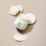ProtoClinical k-beauty warm beige beauty graphic with a soft charcoal horizontal center on a pale background.