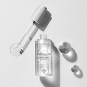 ProtoClinical k-beauty [so natural] White Water Ampoule Serum 50ml shown as a single upright gray bottle centered on a pale beige and white background