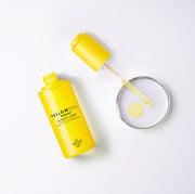 ProtoClinical k-beauty [so natural] Yellow Cica Ampoule 50ml shown with a yellow bottle and matching box on a pale cream and lavender background
