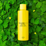 ProtoClinical k-beauty [so natural] Yellow Cica Toner 260ml shown as a single upright yellow bottle centered on a dark green background