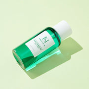 ProtoClinical k-beauty mint green beauty product packaging on a light cream background.