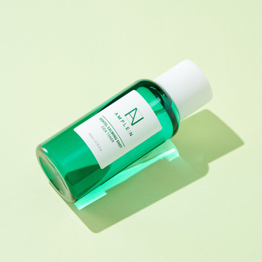 ProtoClinical k-beauty mint green beauty product packaging on a light cream background.