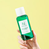 ProtoClinical k-beauty yellow and mint beauty product packaging on a pale background.