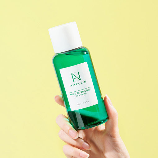 ProtoClinical k-beauty yellow and mint beauty product packaging on a pale background.