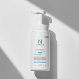 ProtoClinical k-beauty gray and white beauty packaging on a light background.