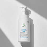 ProtoClinical k-beauty gray and white beauty packaging on a light background.