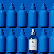ProtoClinical k-beauty deep blue beauty graphic with soft light highlights.