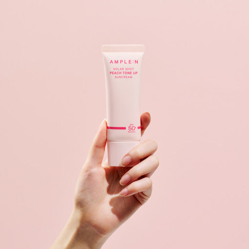 AMPLE:N Solar Shot Peach Tone Up Suncream 40ml by ProtoClinical displayed as a close product packshot with the peach tone-up suncream tube on white for a k-beauty skincare routine.