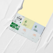 ProtoClinical k-beauty green product set on a soft yellow and white background.
