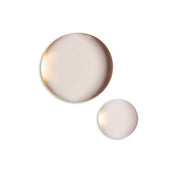 ProtoClinical k-beauty pale gray beauty product silhouette with a soft peach lower edge on a light background.