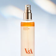 ProtoClinical k-beauty pale beige beauty bottle silhouette with cool blue side accents on a light background.