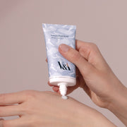 ProtoClinical k-beauty soft mauve beauty bottle silhouette with a dark taupe center on a warm beige background.