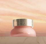 ProtoClinical k-beauty warm tan beauty bottle silhouette centered on a light beige background.