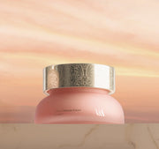 ProtoClinical k-beauty warm tan beauty bottle silhouette centered on a light beige background.