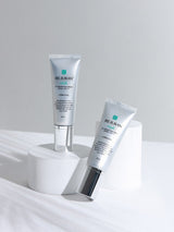 ProtoClinical k-beauty gray beauty graphic with soft vertical bands on a light background.