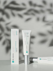 ProtoClinical k-beauty soft gray beauty panel with a warm beige center on a light background.