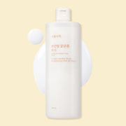 ProtoClinical k-beauty Shingmulnara White Rice Bright Tone Toner 500ml shown as a single centered upright pale yellow package in a square studio packshot on a light background.