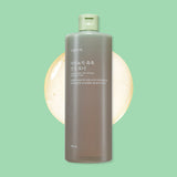 ProtoClinical k-beauty Shingmulnara Young Green Tea Watery Calming Toner 500ml shown in a single centered upright packshot in muted charcoal tones on a soft mint green background