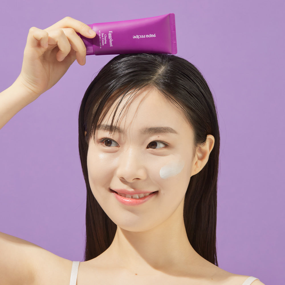ProtoClinical k-beauty papa recipe Eggplant Clearing Sun Cream 50ml (SPF 50+ PA++++) text-focused information panel with stacked purple Korean text, a cream background, and a mauve accent band