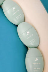 ProtoClinical k-beauty papa recipe Mild Derma Waterfull Sun Lotion 50ml (SPF 50+ PA++++) single blue sun lotion bottle with a warm cream highlight on a light background