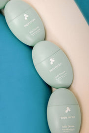 ProtoClinical k-beauty papa recipe Mild Derma Waterfull Sun Lotion 50ml (SPF 50+ PA++++) single blue sun lotion bottle with a warm cream highlight on a light background