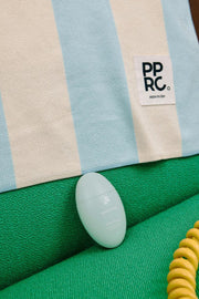 ProtoClinical k-beauty lavender and green beauty graphic with soft blue shading on a light background.