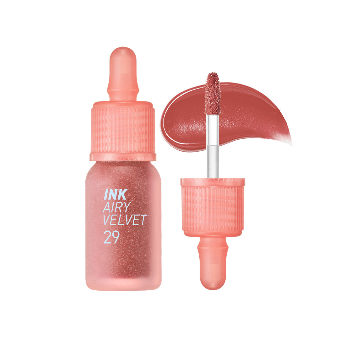 ProtoClinical k-beauty peripera Ink Airy Velvet 4g (NEW #26~#30) single peach-coral lip tint swatch in a rounded shape with brown side shading and pale blue corners on a white background