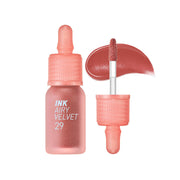 ProtoClinical k-beauty peripera Ink Airy Velvet 4g (NEW #26~#30) single peach-coral lip tint swatch in a rounded shape with brown side shading and pale blue corners on a white background
