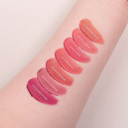 ProtoClinical k-beauty peripera Over Blur Tint 3.5g single coral-rose lip tint swatch with a soft blurred edge on a pale peach background