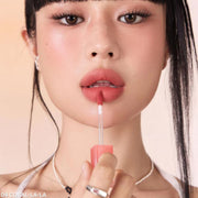 ProtoClinical k-beauty peripera Over Blur Tint 3.5g single rose-beige lip tint tube centered on a soft beige and brown background