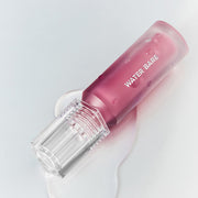 ProtoClinical k-beauty peripera PERIPERA Water Bare Tint single berry-pink lip tint swatch centered on a pale aqua and white background