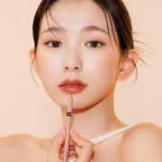 ProtoClinical k-beauty the SAEM Cover Perfection Lip Pencil 2g lineup of 10 slim beige lip pencils standing upright side by side with varied pink and brown tip colors on a white background