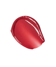 ProtoClinical k-beauty centered red beauty product on a clean white background with soft aqua corner accents.