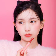 ProtoClinical k-beauty tall pink beauty product packaging on a light background.