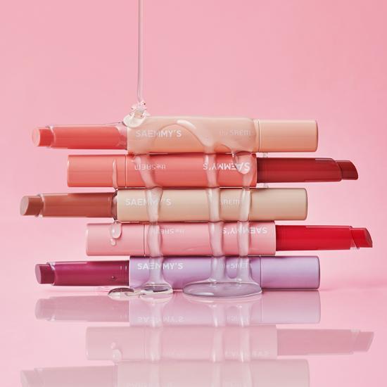 ProtoClinical k-beauty soft pink beauty product packaging on a light pink background.