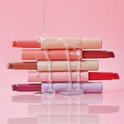 ProtoClinical k-beauty soft pink beauty product packaging on a light pink background.