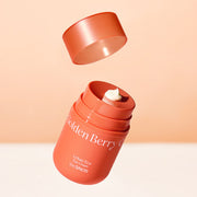 ProtoClinical k-beauty The SAEM Urban Eco Golden Berry C Eye Cream 30ml open coral-orange eye cream jar with the lid floating above and a pale cream dollop visible on a peach background