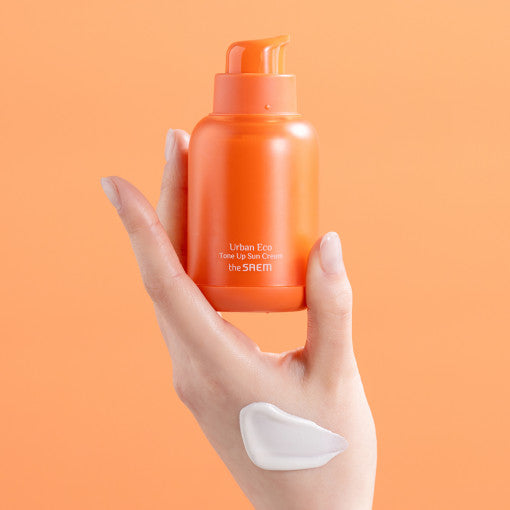 ProtoClinical k-beauty The SAEM Urban Eco Golden Berry C Tone Up Sun Cream 50ml soft peach bottle silhouette centered on a light background