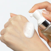 ProtoClinical k-beauty ViveLab Revive Therapy Hair Scalp Enhancing Foam 100ml close-up white foam pumped onto the back of a hand beside a clear pale yellow bottle