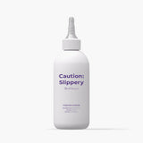 ProtoClinical k-beauty withbecon Caution Slippery Hair Treatment 300ml in a single tall gray treatment bottle centered upright on a white background with pale lavender side shading