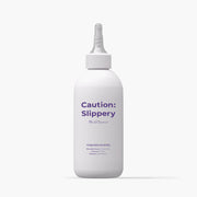 ProtoClinical k-beauty withbecon Caution Slippery Hair Treatment 300ml in a single tall gray treatment bottle centered upright on a white background with pale lavender side shading