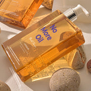 ProtoClinical k-beauty withbecon NoMoreOil Shampoo 360ml golden shampoo packaging centered on a bright blue background