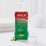 ProtoClinical k-beauty AVCA Mild Mouthwash Cool Mint 800ml single tall dark green mouthwash bottle centered on a pale pink and light blue background