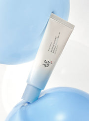 ProtoClinical k-beauty [Beauty of Joseon] Relief Sun Aqua-fresh Rice+B5 (SPF50+ PA++++) 50ml single upright pale blue sunscreen tube centered on a white background with soft coral side accents.